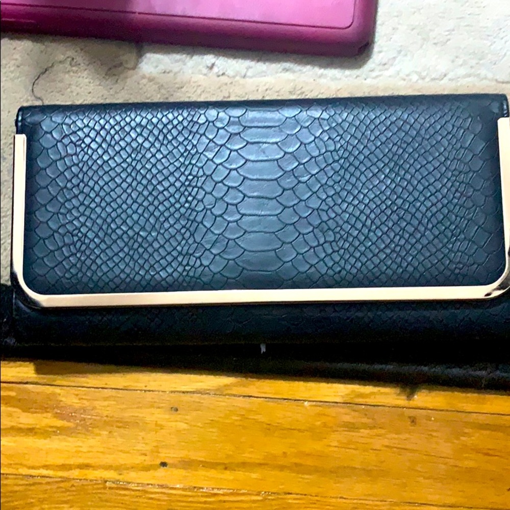 Aldo clutch black and gold